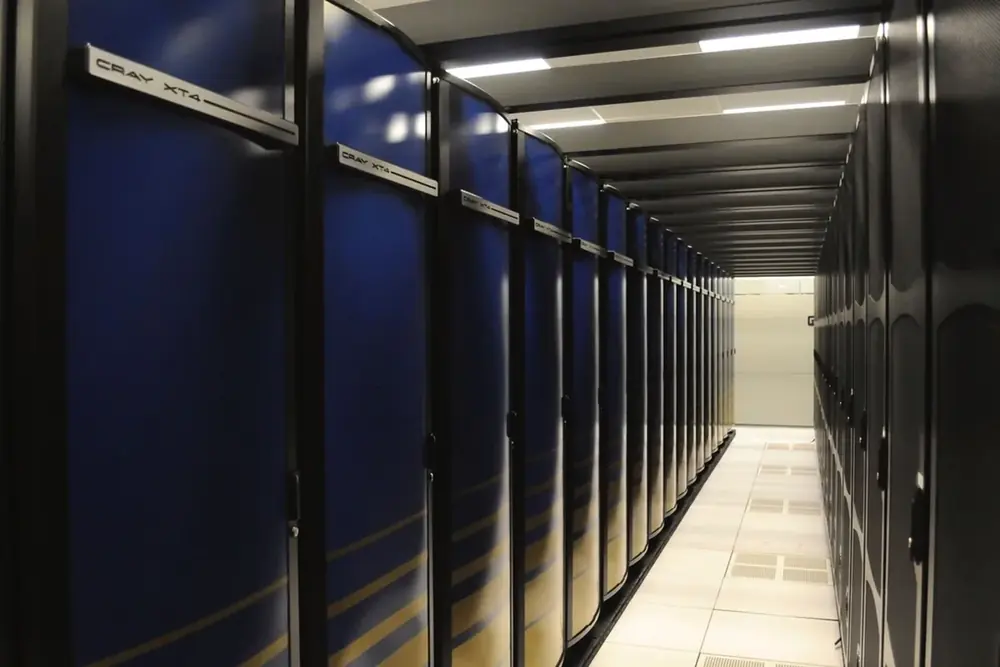 An aisle of server racks in a data centre.